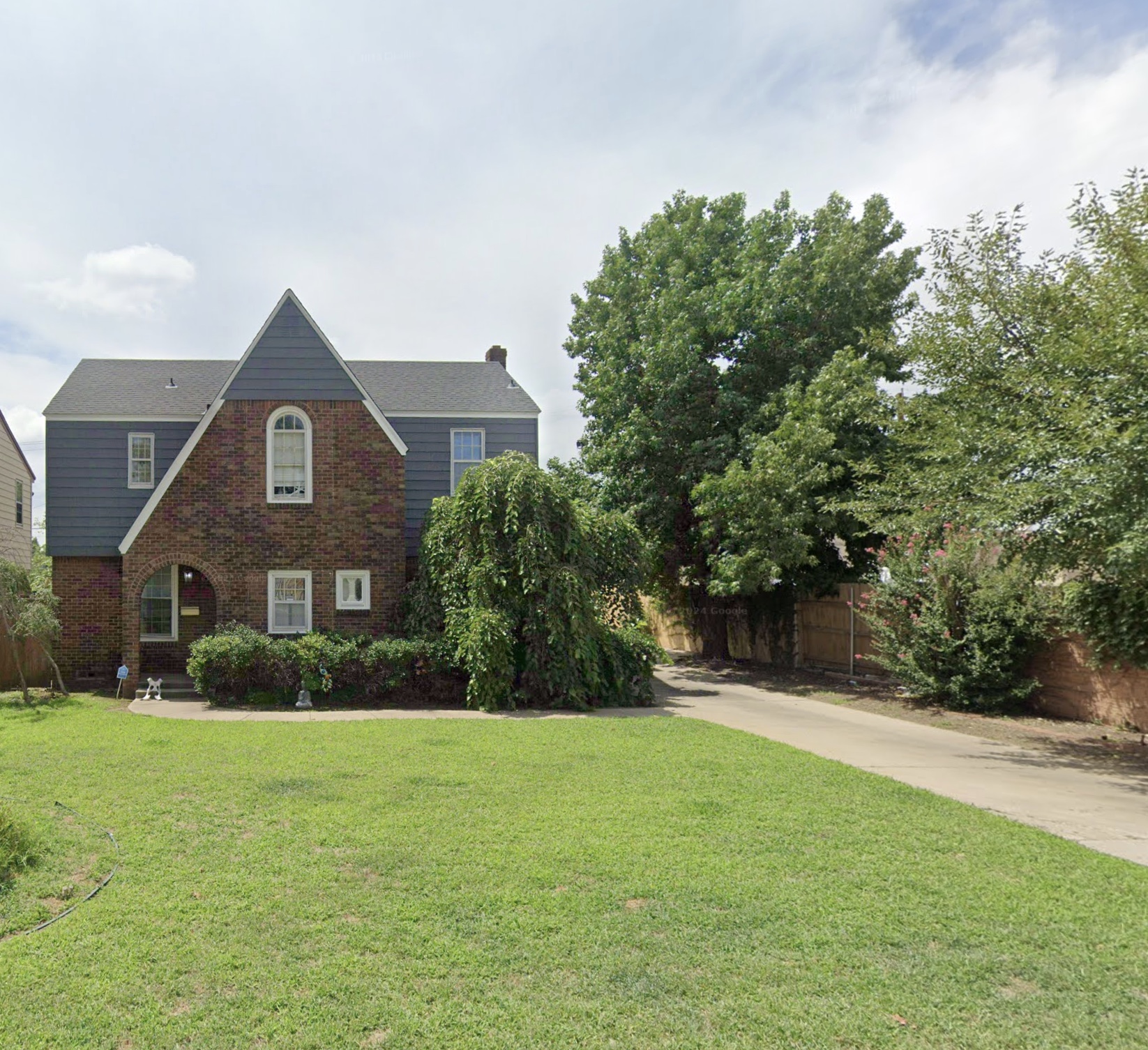 Brick Tudor-style two-story home