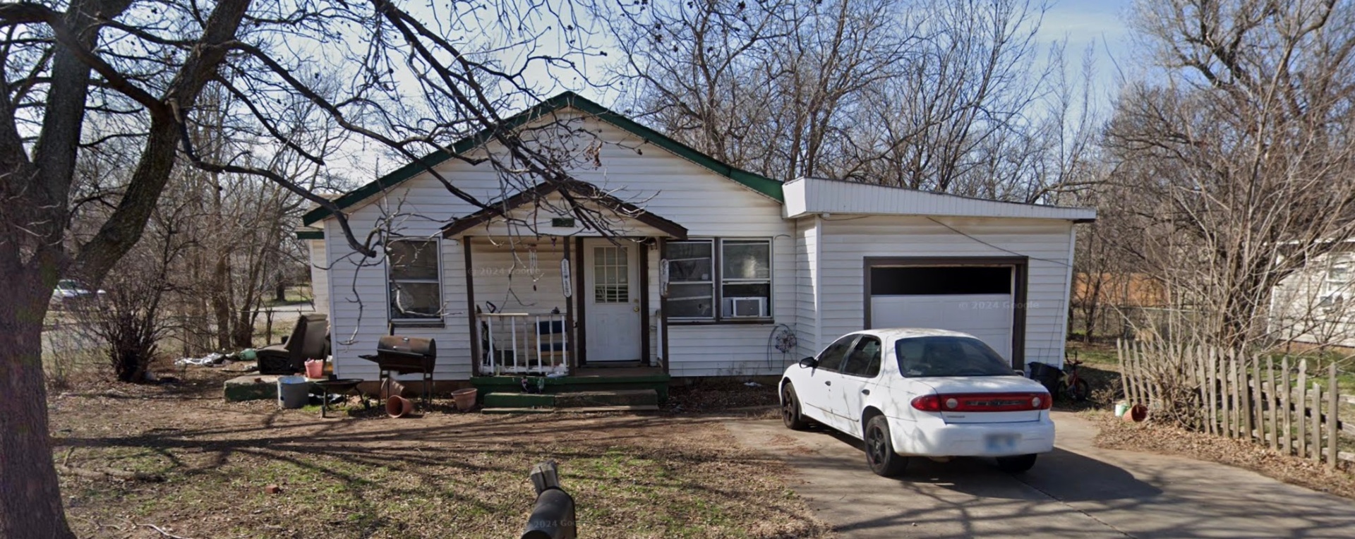 White ranch home with garage
