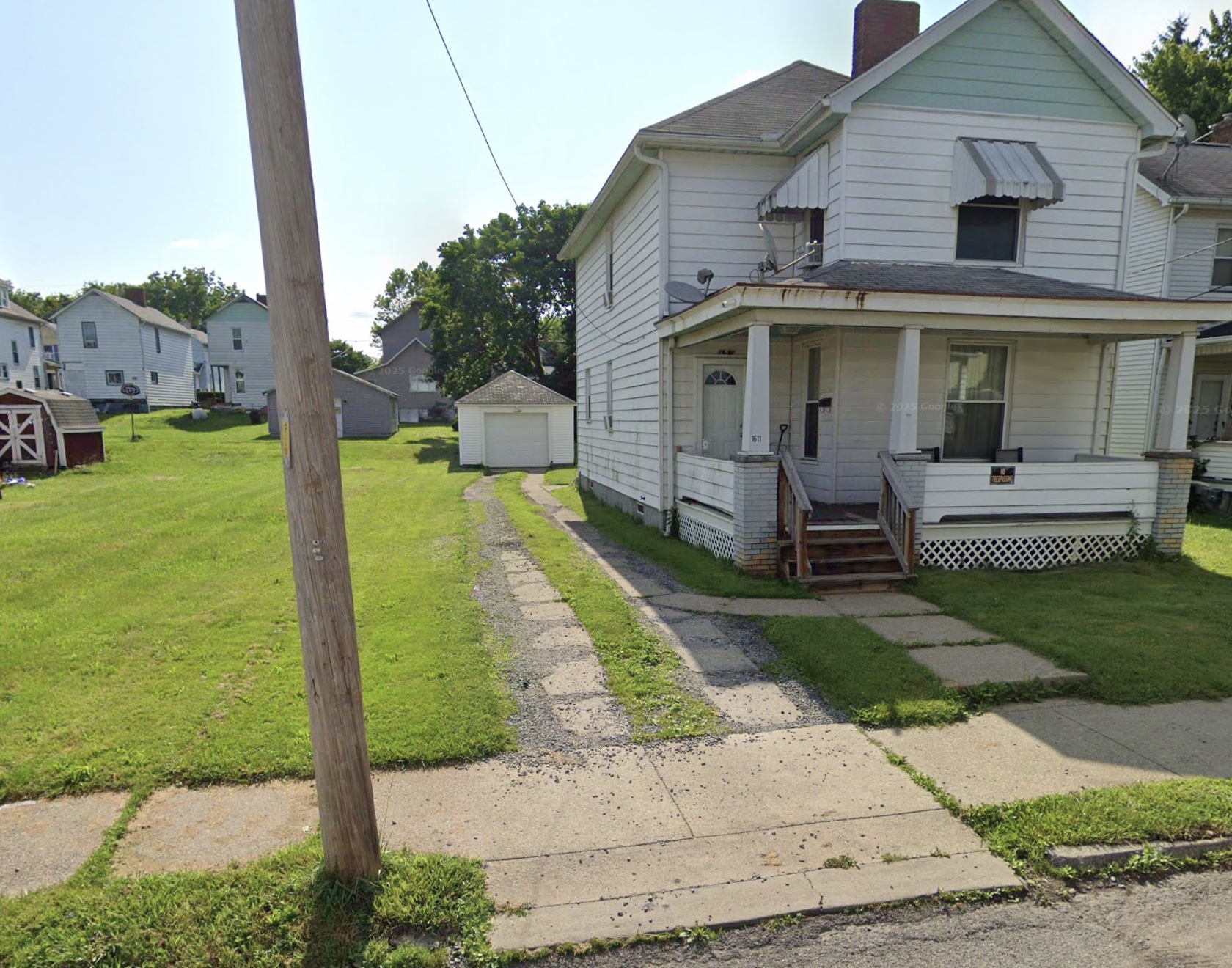 White two-story home with front porch