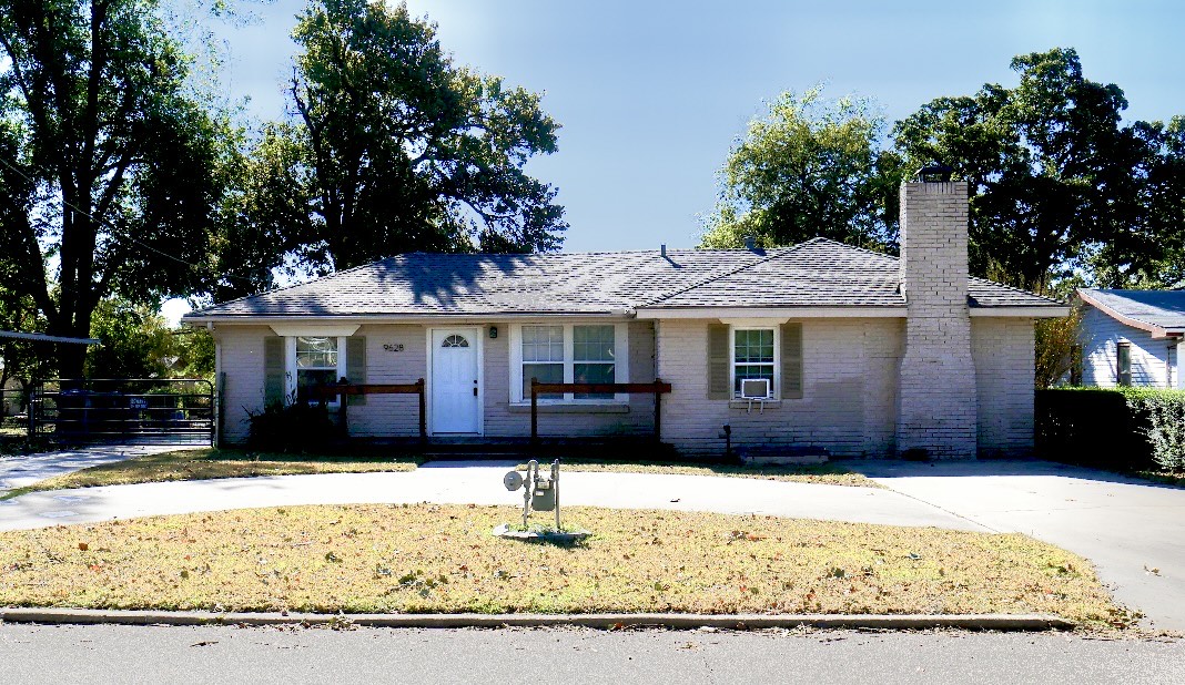 Brick ranch home with circular driveway