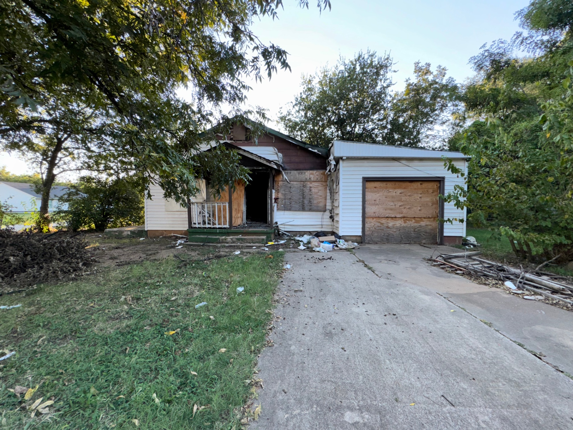Fire-damaged home with boarded windows